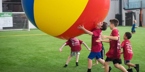 kids playing with large ball